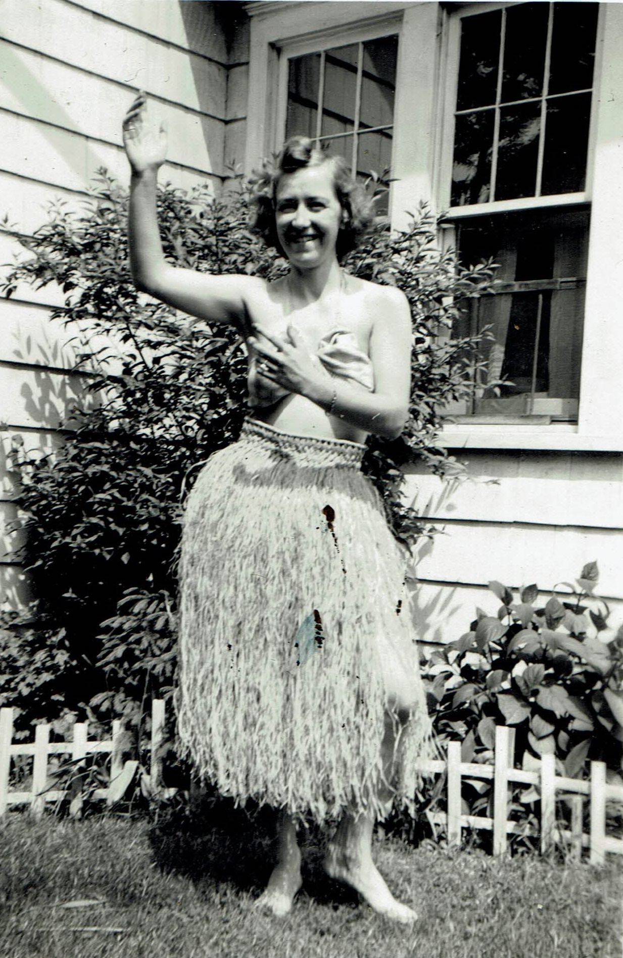 Photo of my sister-in-law, Anna Gretna WALKER 
                      Thompson, wearking a 'grass skirt.'