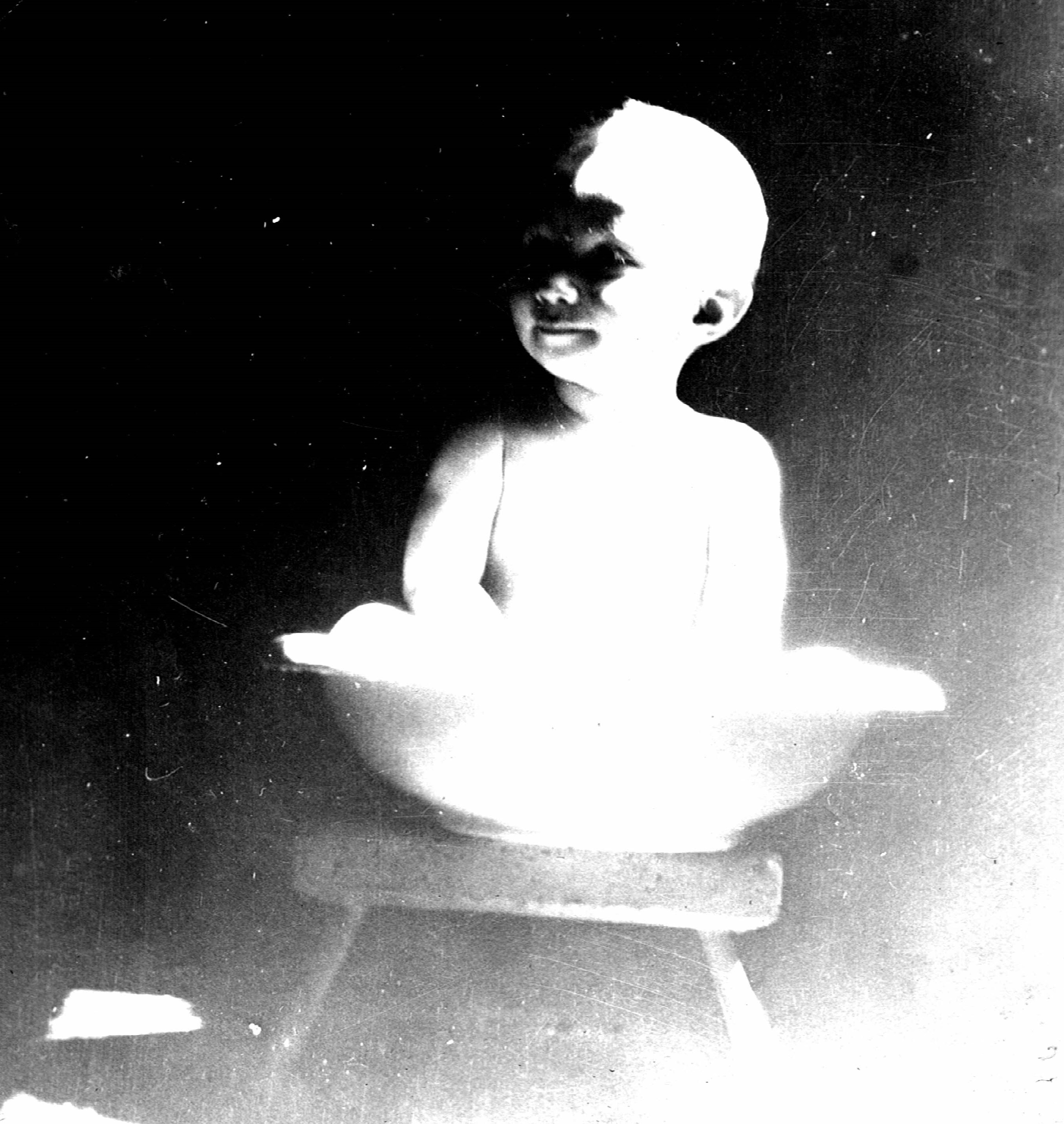 Photo of Walter Thompson, Jr. bathing on a wash stand